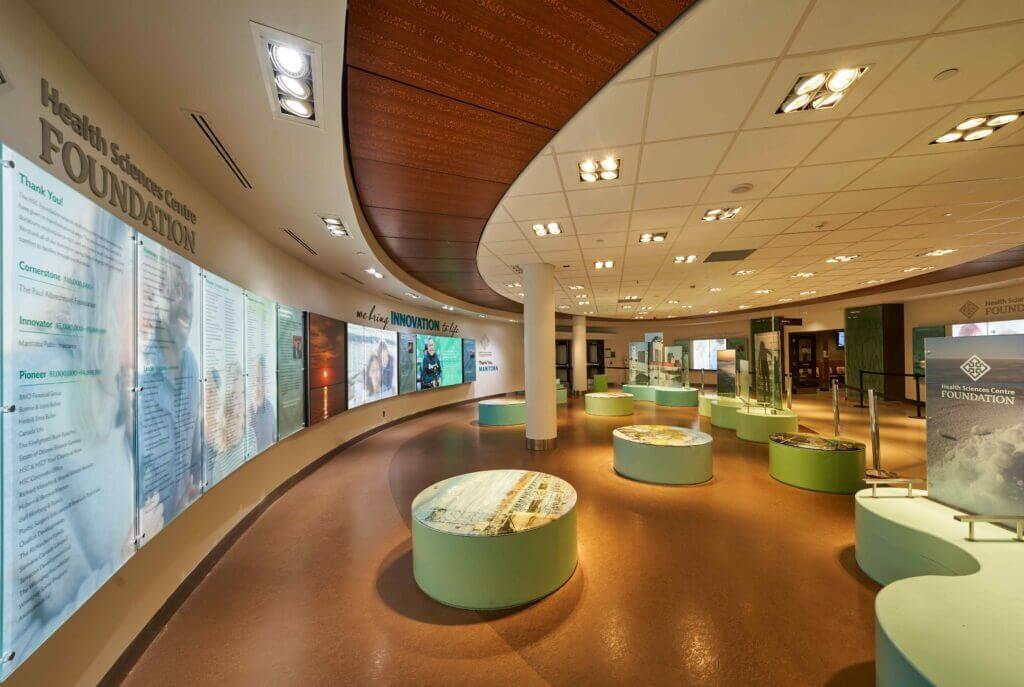 Spacious interior of the Health Science Centre Foundation with informational displays and donor recognition panels